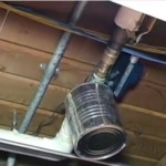 A can suspended by wire is used to prevent a water leak from a pipe at Ferguson Elementary School in Klamath Falls, OR.